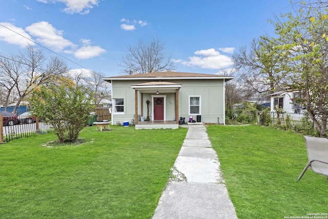 bungalow-style house with a front lawn