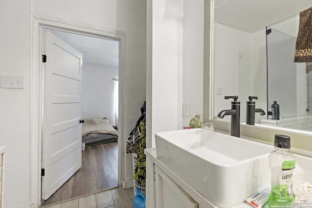 bathroom featuring vanity and hardwood / wood-style flooring