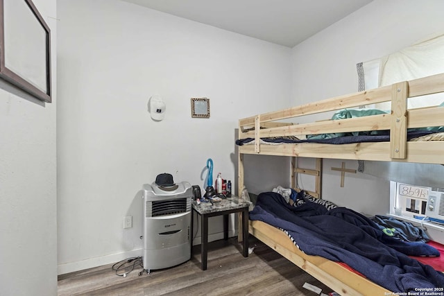 bedroom with wood-type flooring