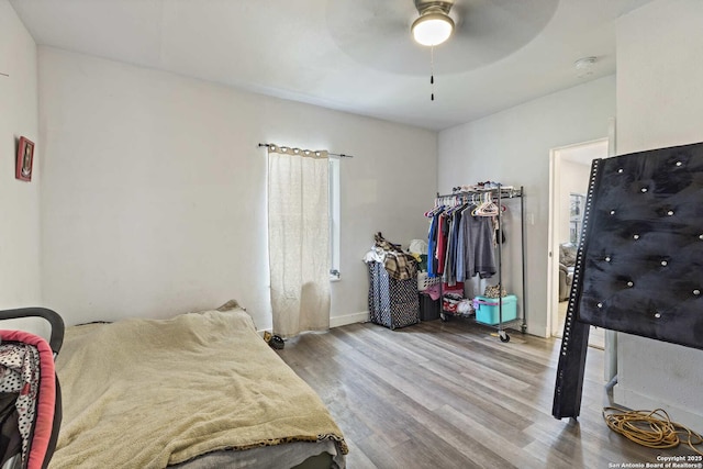 bedroom featuring ceiling fan and wood-type flooring