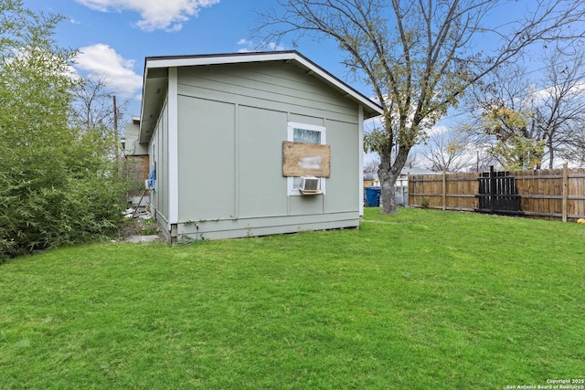 view of home's exterior with a yard and a storage shed