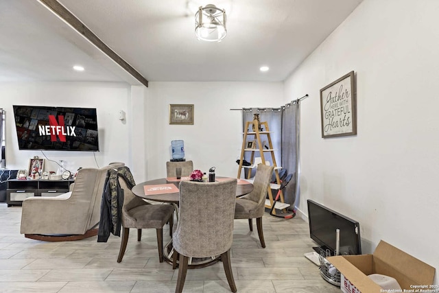 dining room featuring beam ceiling