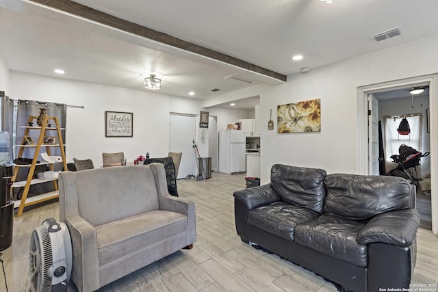 living room with beam ceiling