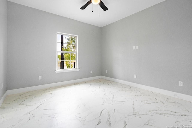 spare room with ceiling fan