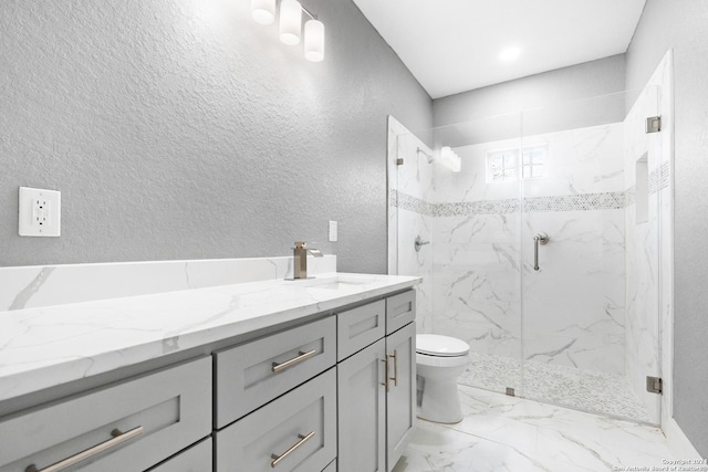 bathroom with vanity, toilet, and an enclosed shower