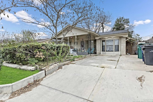 ranch-style house featuring a porch