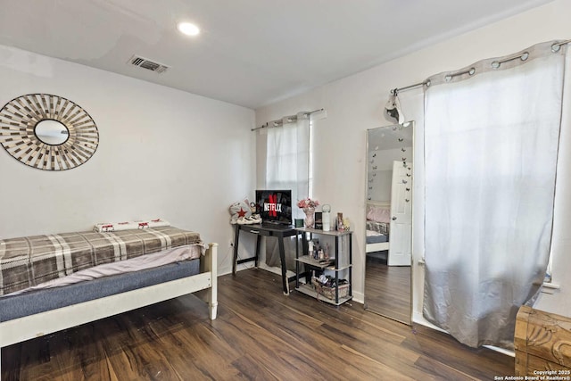 bedroom featuring dark wood-type flooring