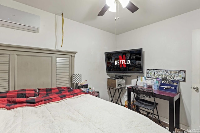 bedroom featuring ceiling fan and a wall mounted air conditioner