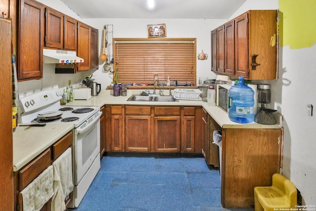 kitchen with electric range, sink, and vaulted ceiling