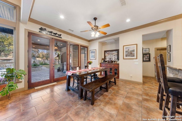 dining space featuring crown molding, french doors, and ceiling fan