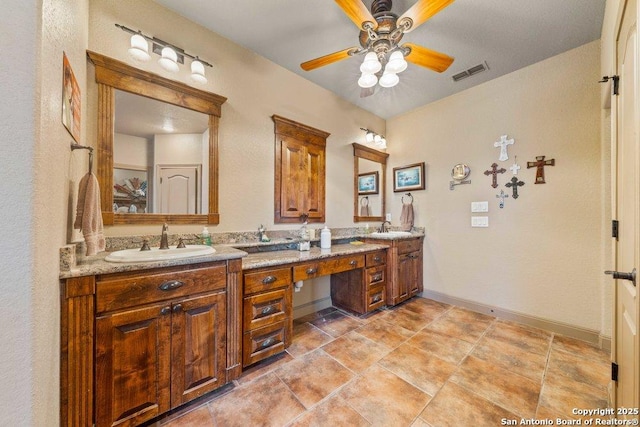 bathroom with ceiling fan and vanity