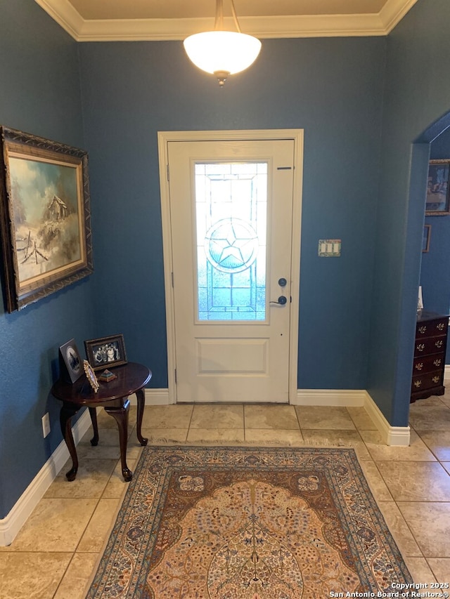 entrance foyer featuring tile patterned flooring and crown molding