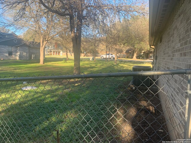 view of yard with central AC unit