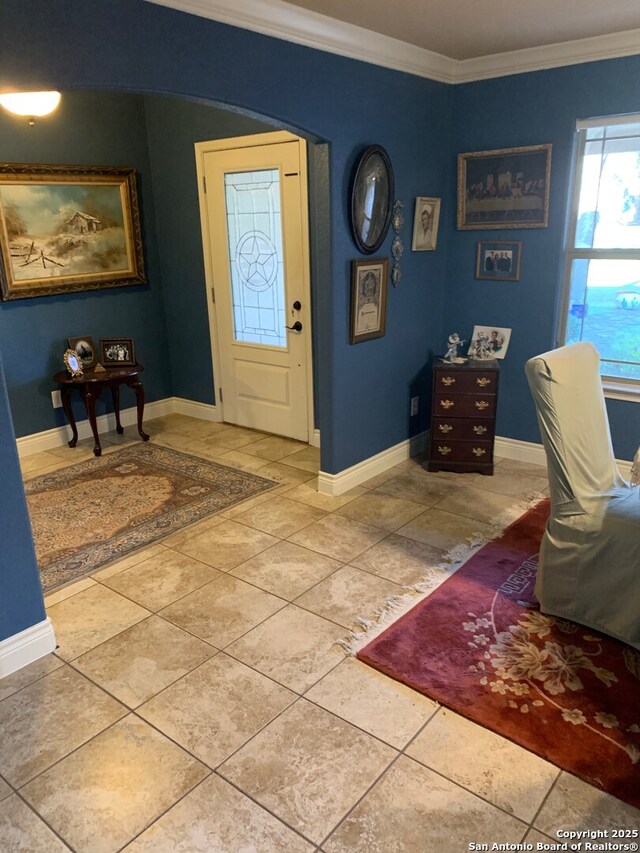 tiled entryway with crown molding