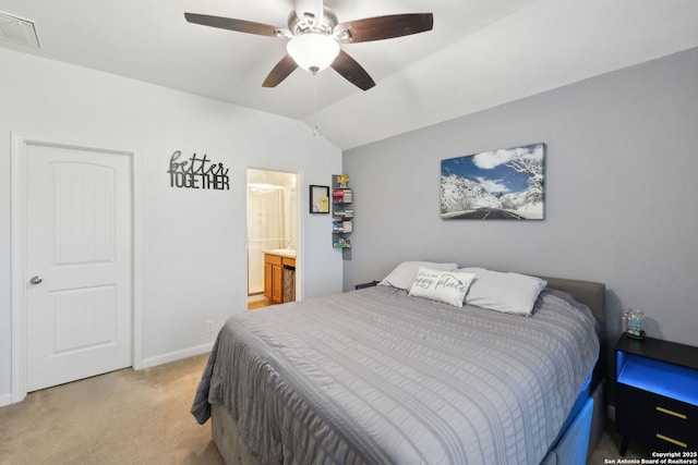 carpeted bedroom featuring connected bathroom, ceiling fan, and vaulted ceiling