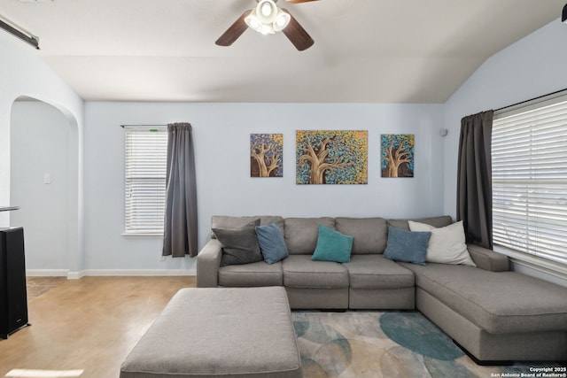 living room featuring ceiling fan and vaulted ceiling