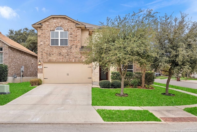 view of front of home featuring a garage, central air condition unit, and a front yard