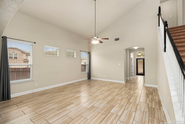 spare room featuring ceiling fan and high vaulted ceiling