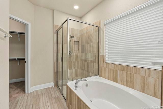 bathroom with separate shower and tub