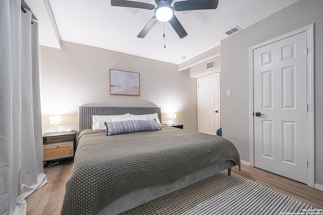 bedroom featuring hardwood / wood-style floors and ceiling fan