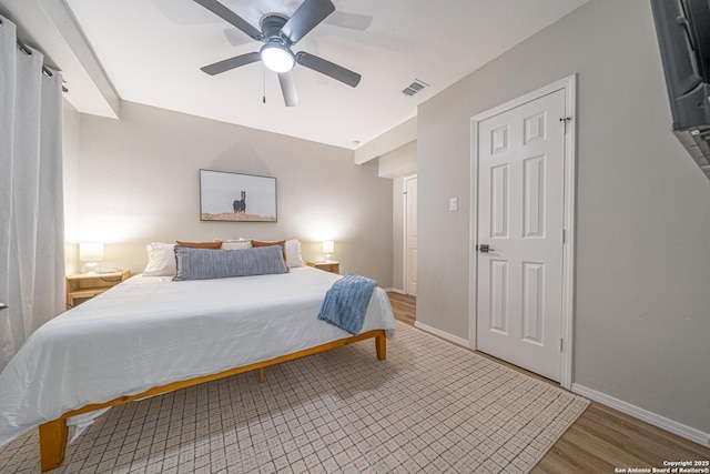 bedroom featuring ceiling fan and hardwood / wood-style flooring