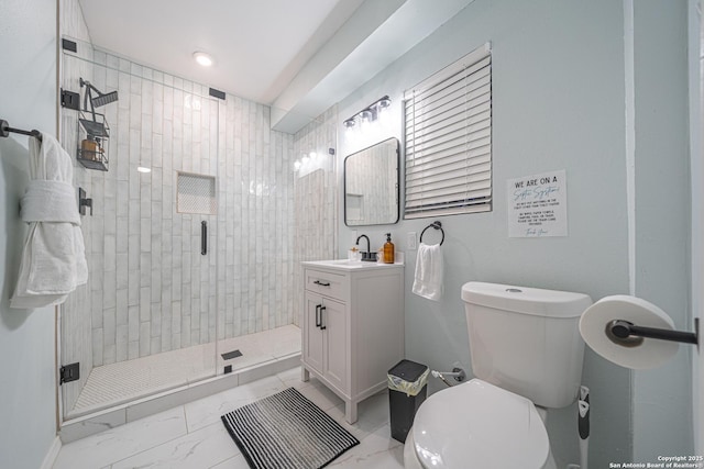 bathroom with vanity, toilet, and walk in shower