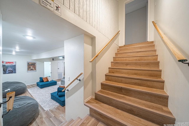 stairs with wood-type flooring