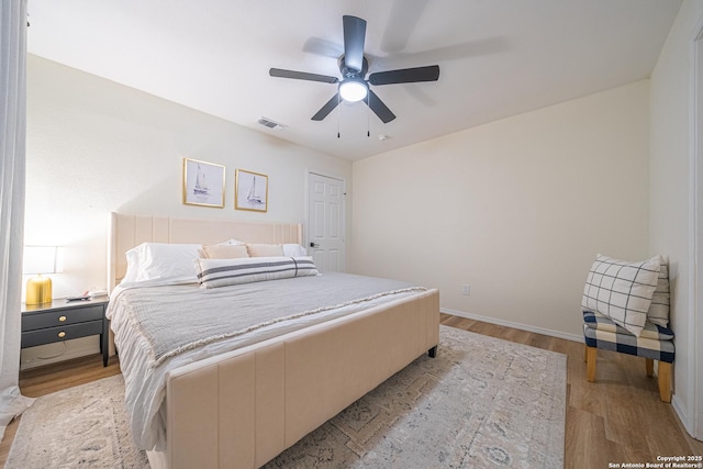 bedroom featuring ceiling fan and light wood-type flooring