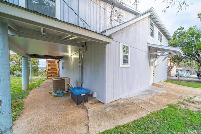 view of home's exterior with central AC unit