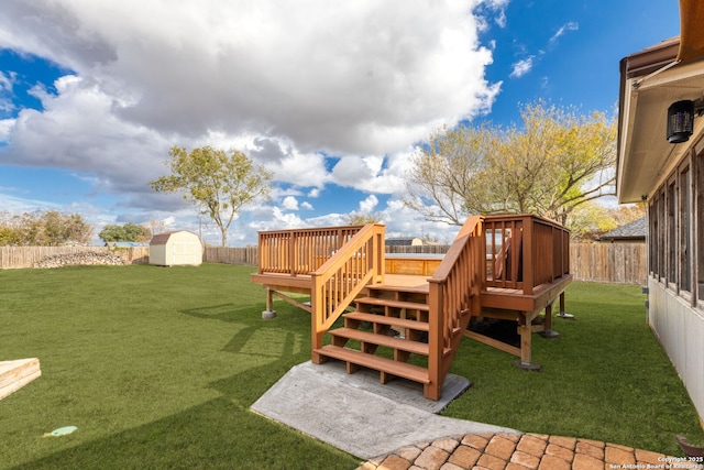 view of yard featuring a shed and a deck