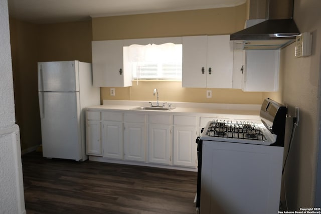 kitchen featuring stainless steel electric range oven, sink, wall chimney range hood, white refrigerator, and white cabinets