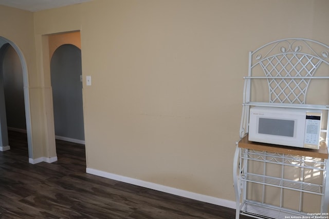 spare room featuring dark hardwood / wood-style floors