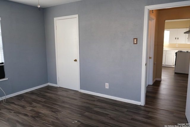 empty room featuring dark hardwood / wood-style floors