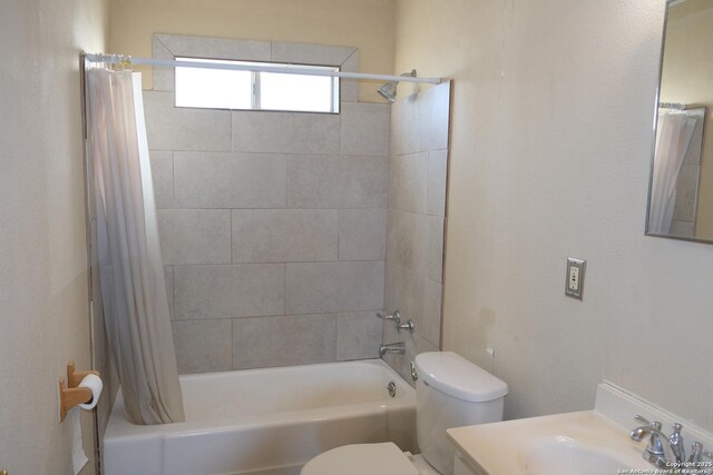 full bathroom featuring shower / bath combination with curtain, vanity, and toilet