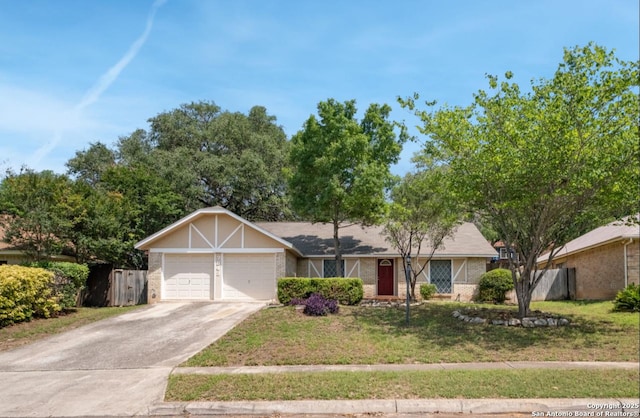 ranch-style home featuring a front lawn and a garage