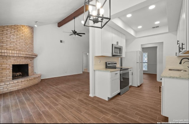 kitchen featuring backsplash, sink, white cabinets, and stainless steel appliances