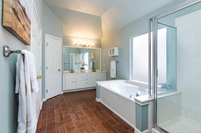 bathroom featuring vanity and shower with separate bathtub