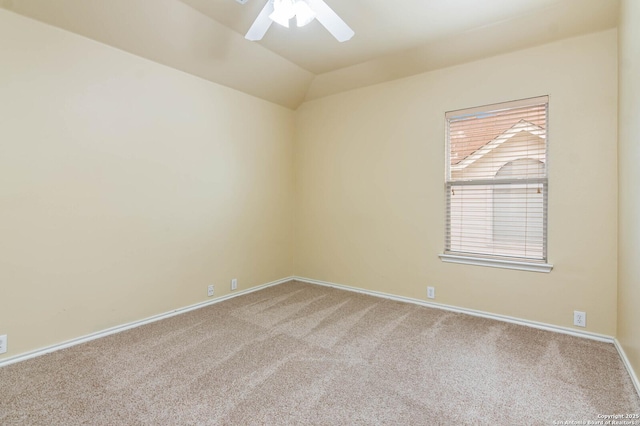 unfurnished room featuring ceiling fan, light carpet, and vaulted ceiling