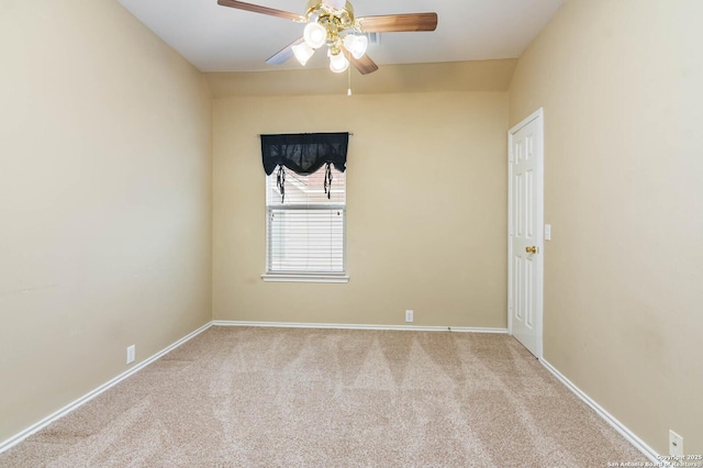 carpeted empty room featuring ceiling fan