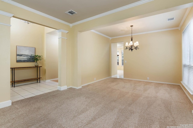 unfurnished room featuring light carpet, ornate columns, ornamental molding, and a notable chandelier