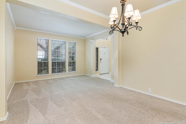 spare room featuring light carpet, crown molding, and a notable chandelier