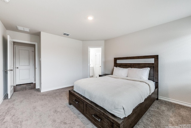 bedroom featuring light carpet