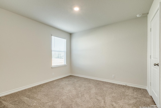 unfurnished room with carpet flooring