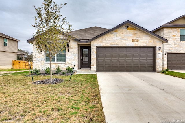 view of front facade featuring a front yard and a garage