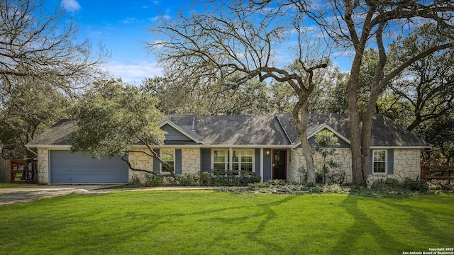 single story home featuring a garage and a front lawn