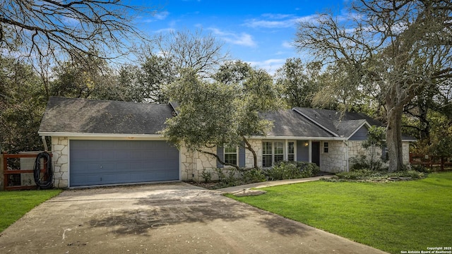 ranch-style house with a garage and a front yard