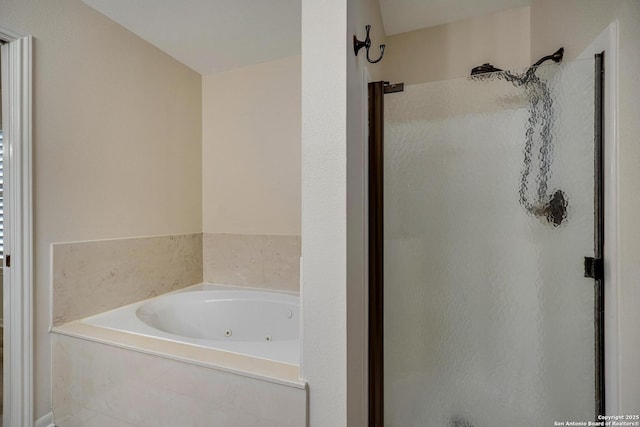 bathroom featuring shower with separate bathtub