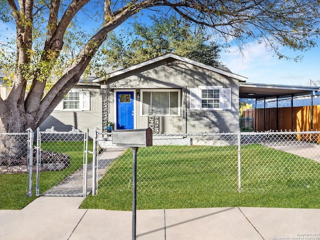 view of front of house featuring a carport and a front lawn