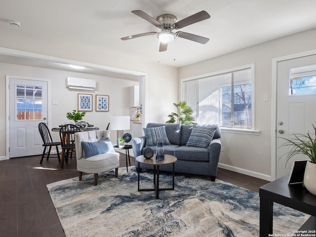 living room with a healthy amount of sunlight, a wall mounted AC, dark wood-type flooring, and ceiling fan