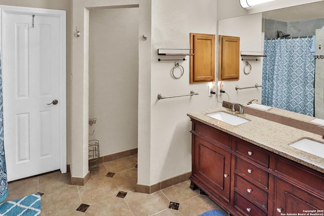 bathroom with tile patterned floors, vanity, and a shower with shower curtain